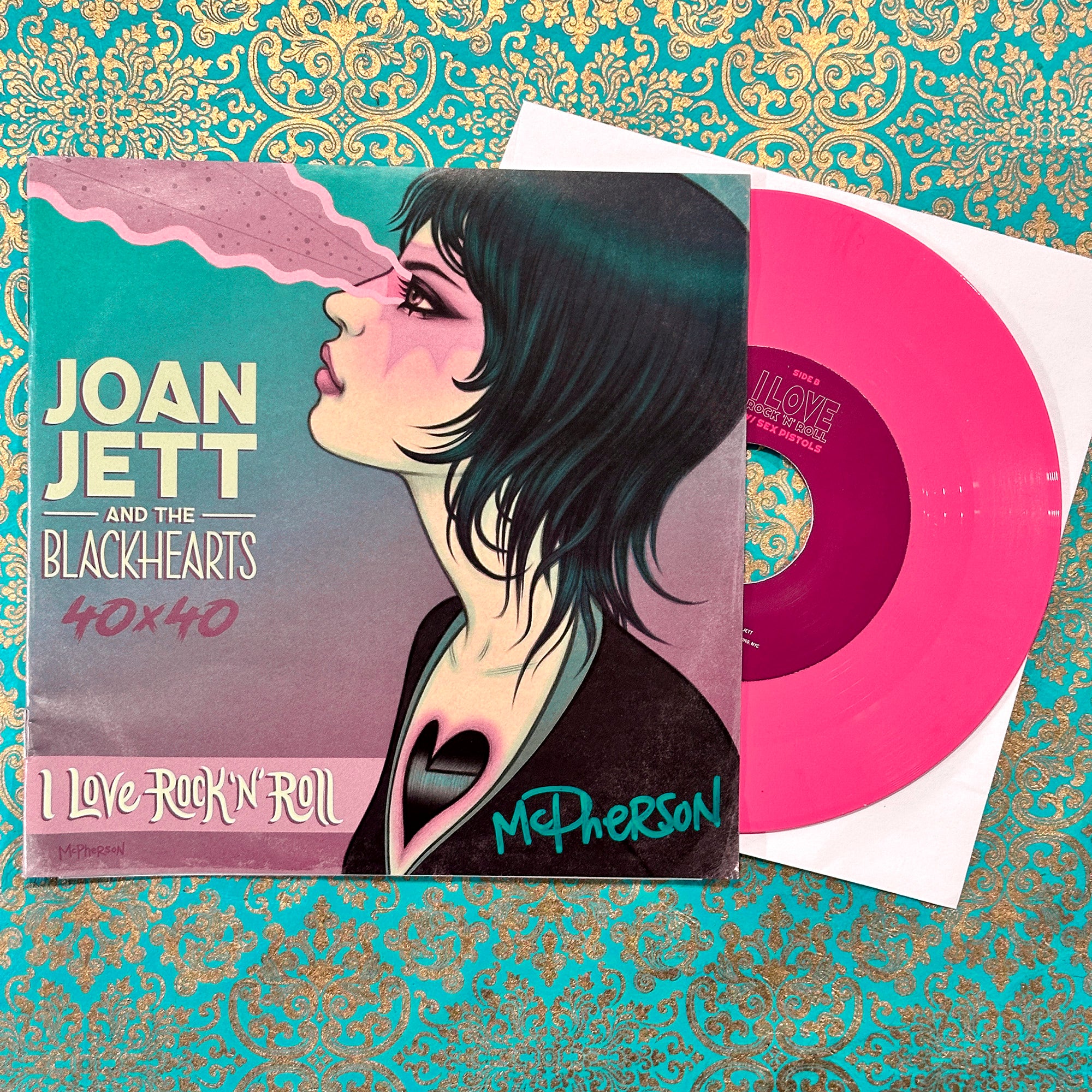 Vinyl record with cover featuring Joan Jett and the Blackhearts on a decorative background