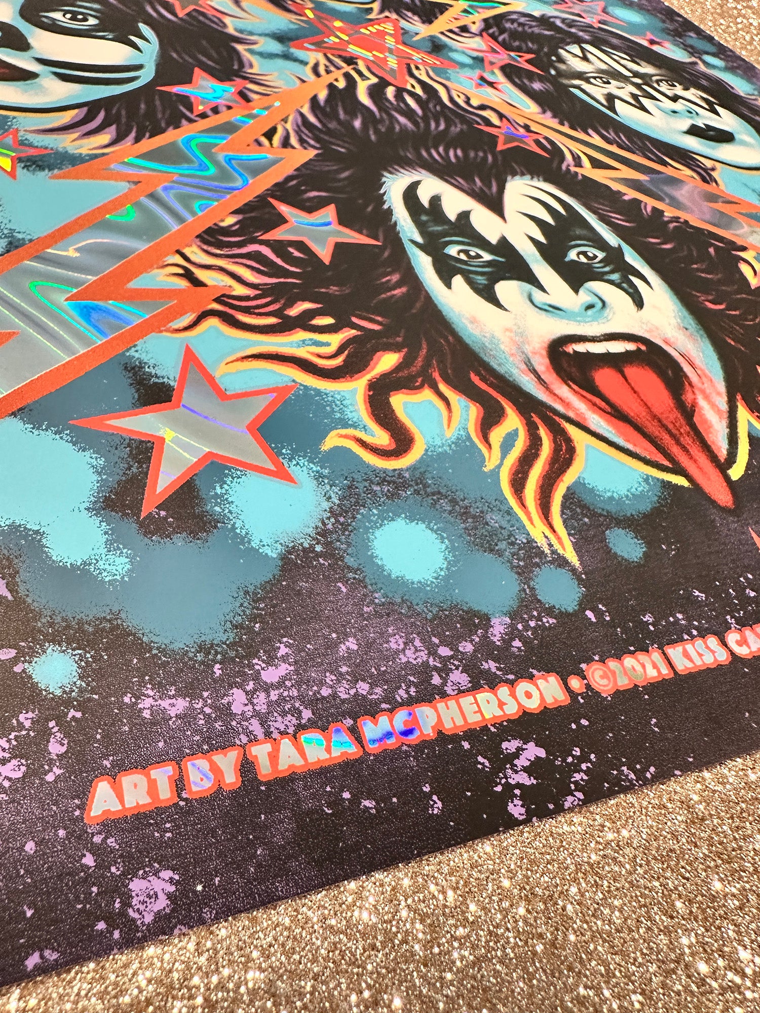 Colorful graphic design with a face and star on a textured surface