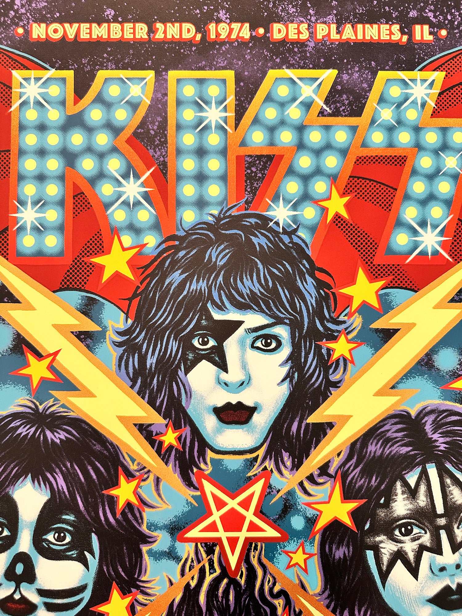 Vintage concert poster for KISS featuring band members and dynamic design elements.