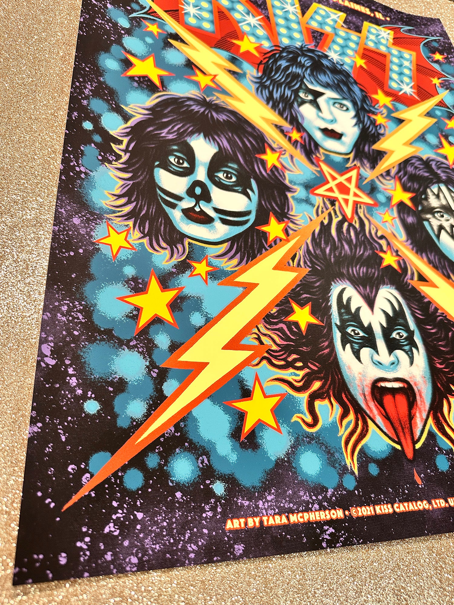 Colorful poster with stylized faces and lightning bolts on a dark background